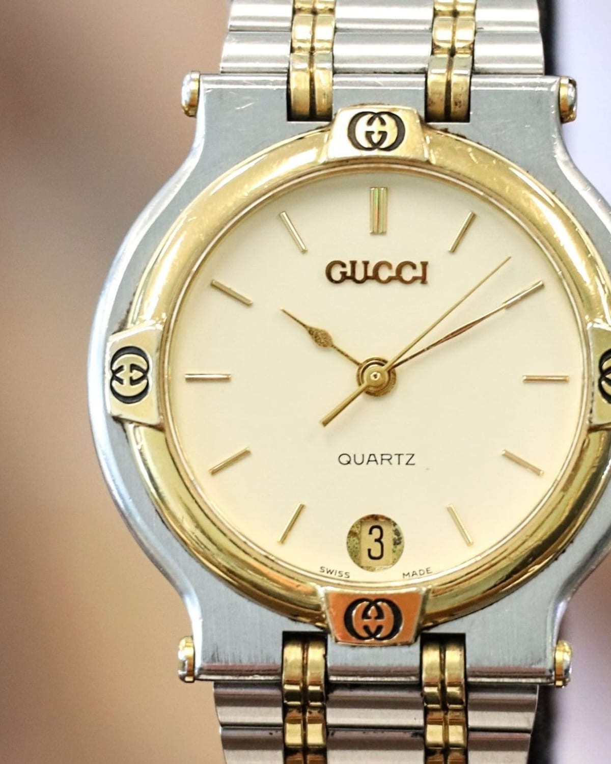 Reference image of a two-tone Gucci 9000M with ivory dial