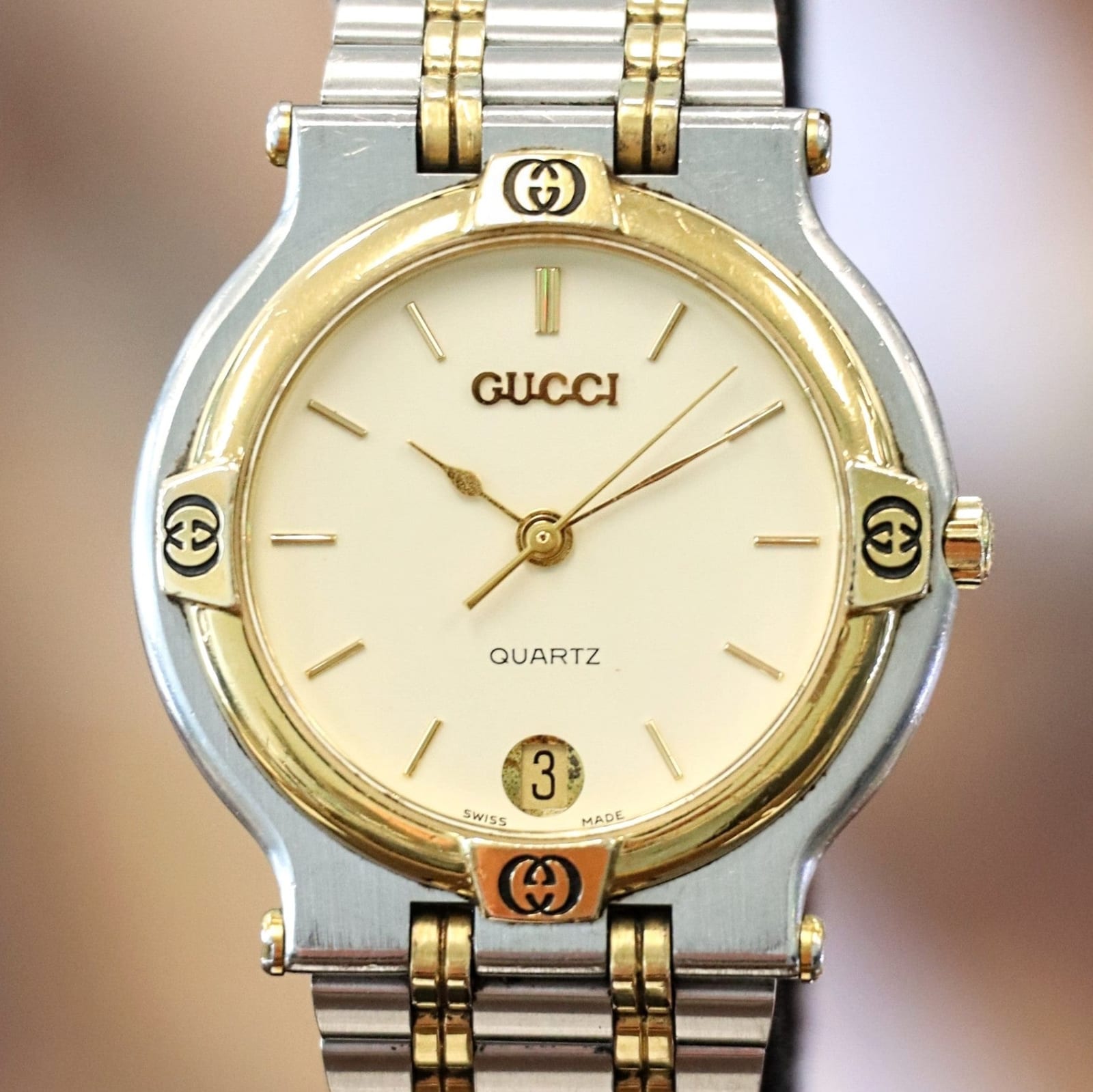 Reference image of a two-tone Gucci 9000M with ivory dial